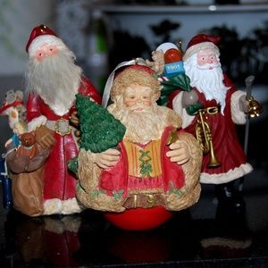 Three Hallmark Santa Ornaments